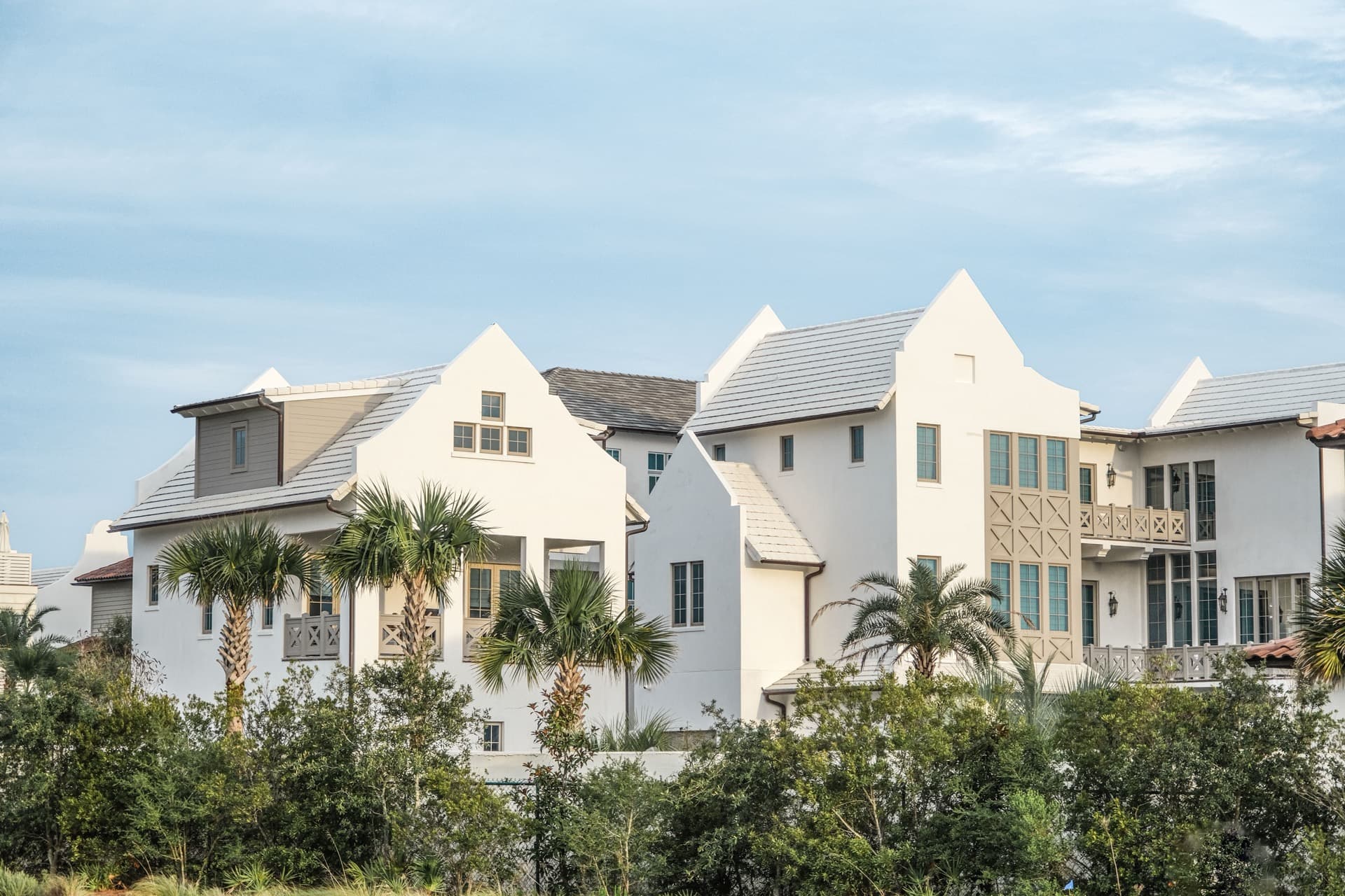 South Florida coastal buildings with tile roofing and palm trees